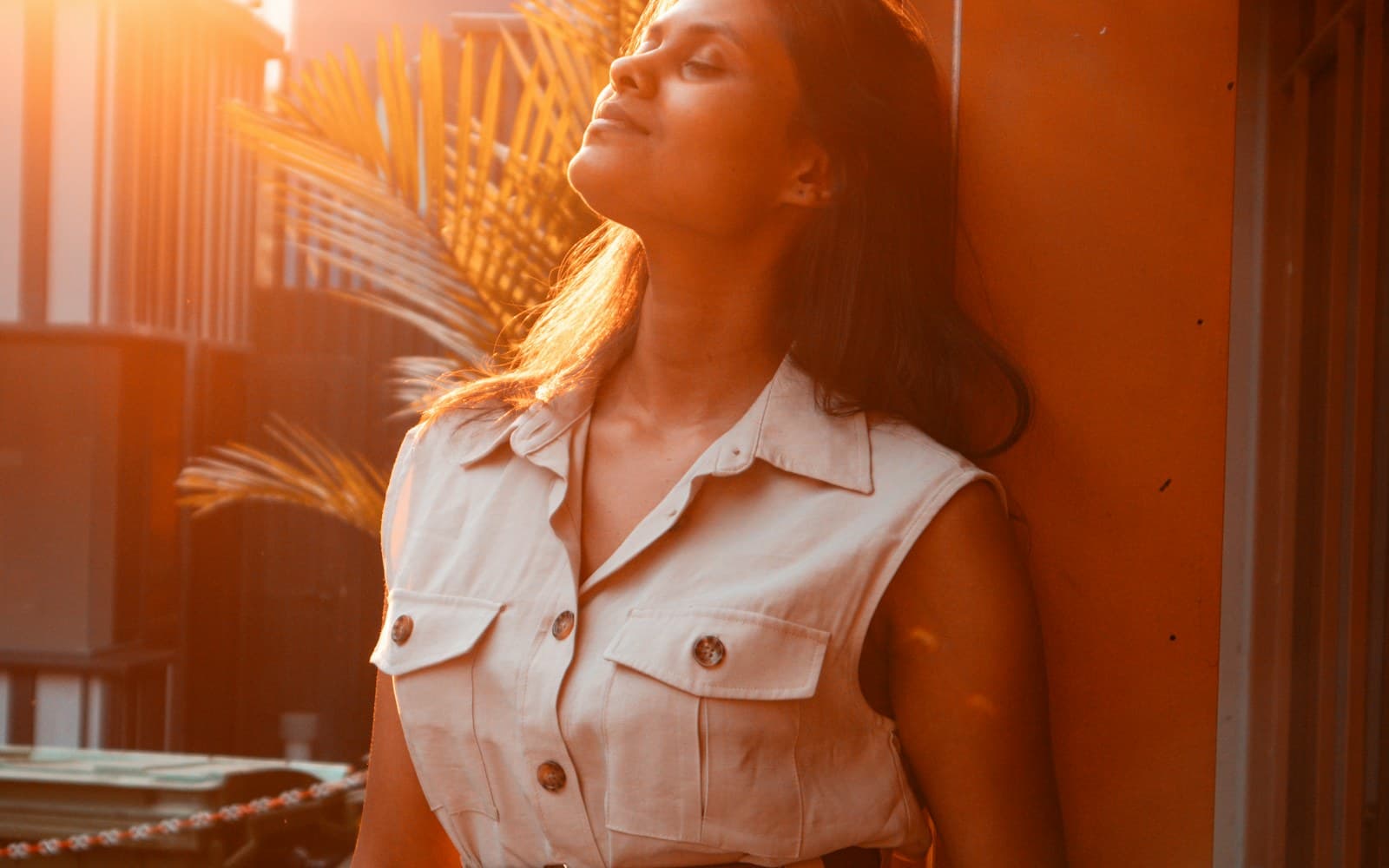 A woman standing in warm natural sunlight